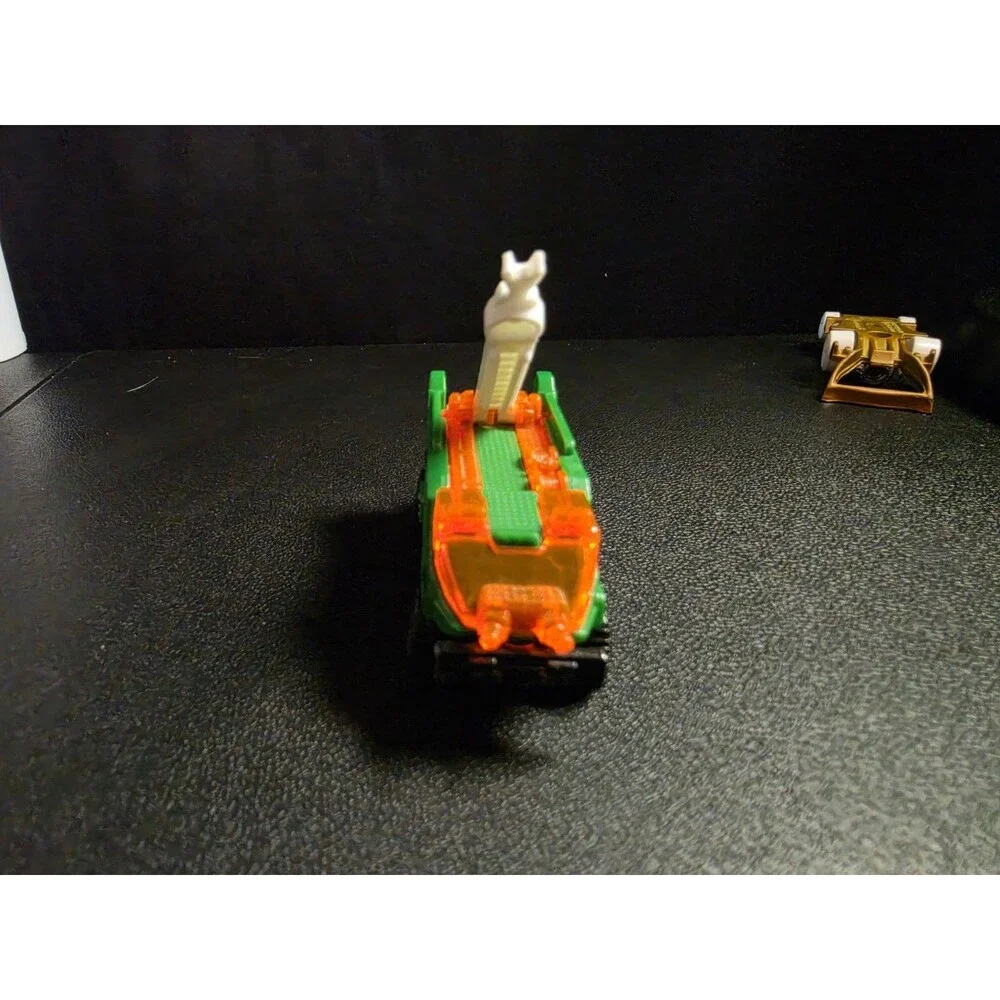 Lot of 4 loose Hot Wheels vehicles in pre-owned condition.